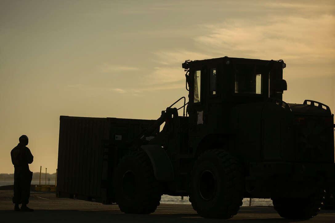 U.S. Marines with the 26th Marine Expeditionary Unit (MEU) load supplies aboard the amphibious transport dock USS New York (LPD-21) as part of Composite Training Unit Exercise (COMPTUEX) at Morehead City, N.C., Nov. 5, 2017. The 26th MEU is scheduled to conduct Composite Training Unit Exercise, its final pre-deployment training exercise in preparation for an upcoming deployment at sea.