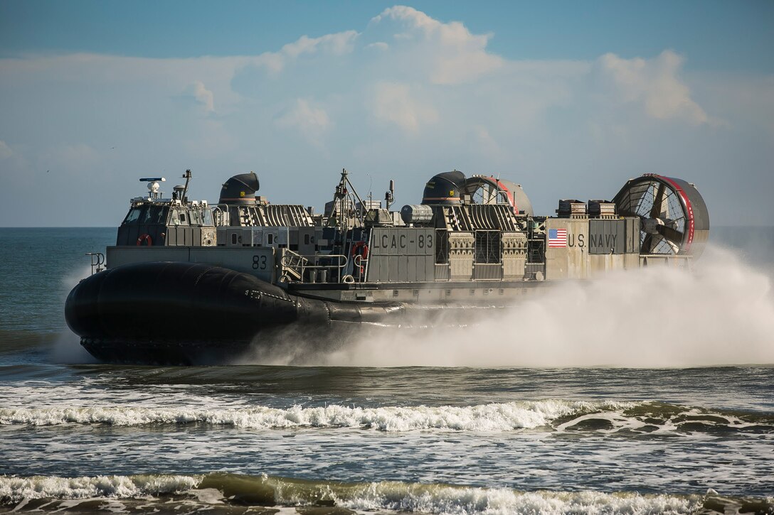 U.S. Navy Landing Craft, Air Cushion 83, prepares to land at Onslow Beach to transport Marines and Sailors to embark the amphibious assault ship USS Iwo Jima (LHD-7) as part of Composite Training Unit Exercise (COMPTUEX) at Onslow Beach, Camp Lejeune, N.C., Nov. 5, 2017. The 26th MEU is scheduled to conduct Composite Training Unit Exercise, its final pre-deployment training exercise in preparation for an upcoming deployment at sea.