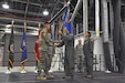 Maj. Gen. Jefferson Burton, the Adjutant General of the Utah National Guard, hands the 151st Air Refueling Wing guidon to Col. Ryan Ogan, the new commander of the 151st ARW, during the change of command ceremony held at Roland R. Wright Air National Guard Base on Nov. 4, 2017. (U.S. Air National Guard photo by Tech. Sgt. Annie Edwards)