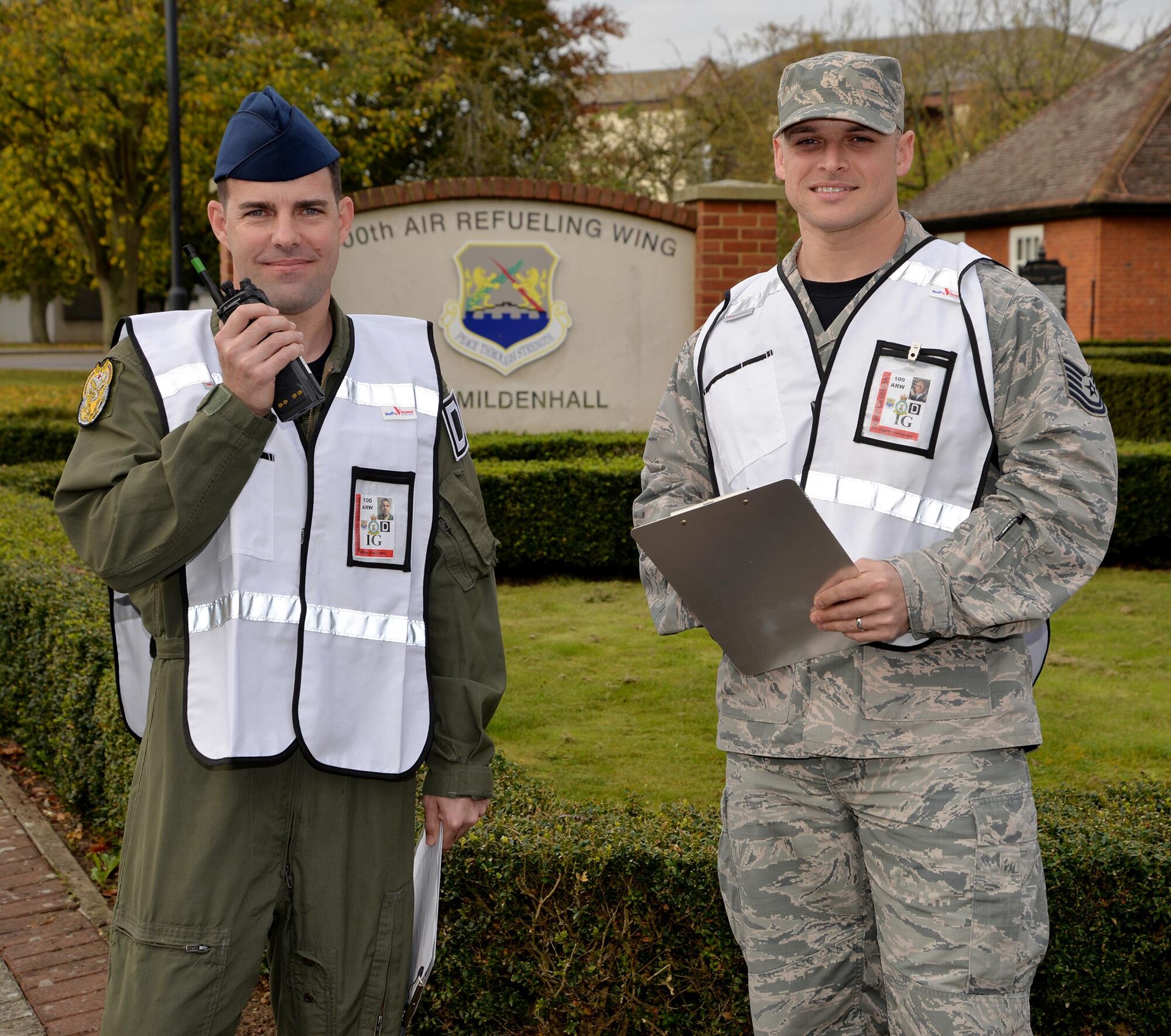U.S. Air Force Master Sgt. Robert King and U.S. Air Force Tech. Sgt. Nicolas Bevilacqua, 100th Air Refueling Wing Inspector General inspection and exercise planners, show off their “white cell” vests as they pose for a photo Nov. 3, 2017, on RAF Mildenhall, England. The IG members wear white vests and wing inspection team members wear red vests to show their non-player status as they evaluate each scenario to ensure it is played out correctly. RAF Mildenhall members should treat the exercise scenario as though the evaluators are not there, and respond accordingly to the situation. (U.S. Air Force photo by Karen Abeyasekere)
