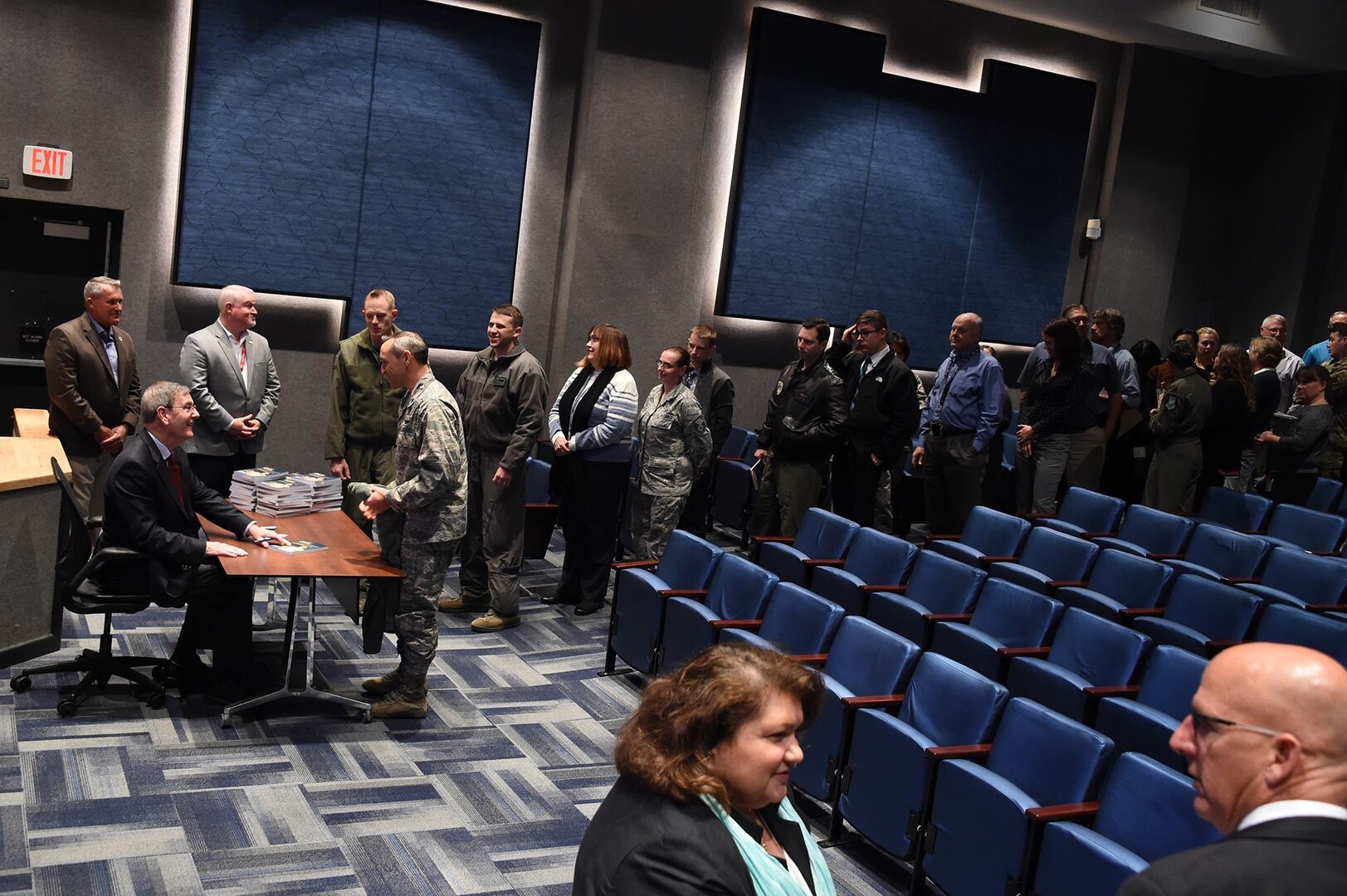 Retired U.S. Air Force Gen. Stephen Lorenz signs copies of his book, titled Lorenz on Leadership, after his presentation to members of U.S. Strategic Command at Offutt Air Force Base, Neb., Nov. 6, 2017. Lorenz, who retired as commander of Air Education and Training Command, discussed the traits and practices of effective leaders based on his experience as a military officer and commander.