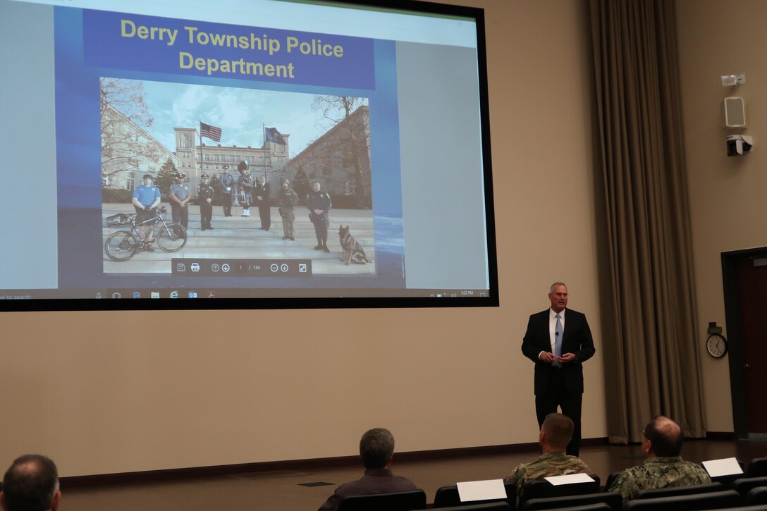 Patrick M. O’Rourke, Sr., former Derry Township police chief and current security manager with the Global Security team at the Hershey Company speaks during a force protection lecture series which highlighted photos of the 2011 flooding in Hershey, Pennsylvania, and the efforts of the Derry Township Police Department on Oct. 27 at DLA Distribution Susquehanna, Pennsylvania.