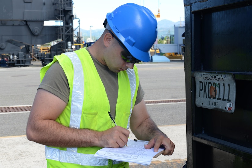 U.S. Army Private 1st Class Matthew Woods, cargo specialist from the 690th Rapid Port Opening Element, 832nd Transportation Battalion, 597th Transportation Brigade based at Joint Base Langley-Eustis, Va., documents the control number for a vehicle unloaded from Military Sealift Command’s USNS Brittin at the Port of Ponce, Puerto Rico, Nov. 4, 2017.