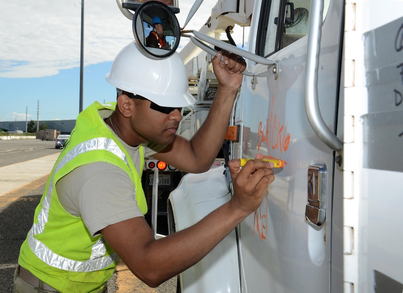 U.S. Army Specialist Jordan Turner, cargo specialist from the 690th Rapid Port Opening Element, 832nd Transportation Battalion, 597th Transportation Brigade based at Joint Base Langley-Eustis, Va., marks a vehicle once it has been unloaded from Military Sealift Command’s USNS Brittin and logged at the Port of Ponce, Puerto Rico, Nov. 4, 2017.