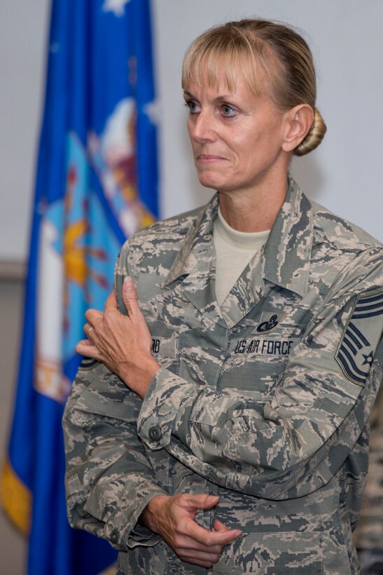 U.S. Air Force Reserve Chief Master Sgt. Kimberly Lord, superintendent, 913th Airlift Group, explains what new chief stripes mean to her during a promotion ceremony at Little Rock Air Force Base, Ark., Nov. 3, 2017.