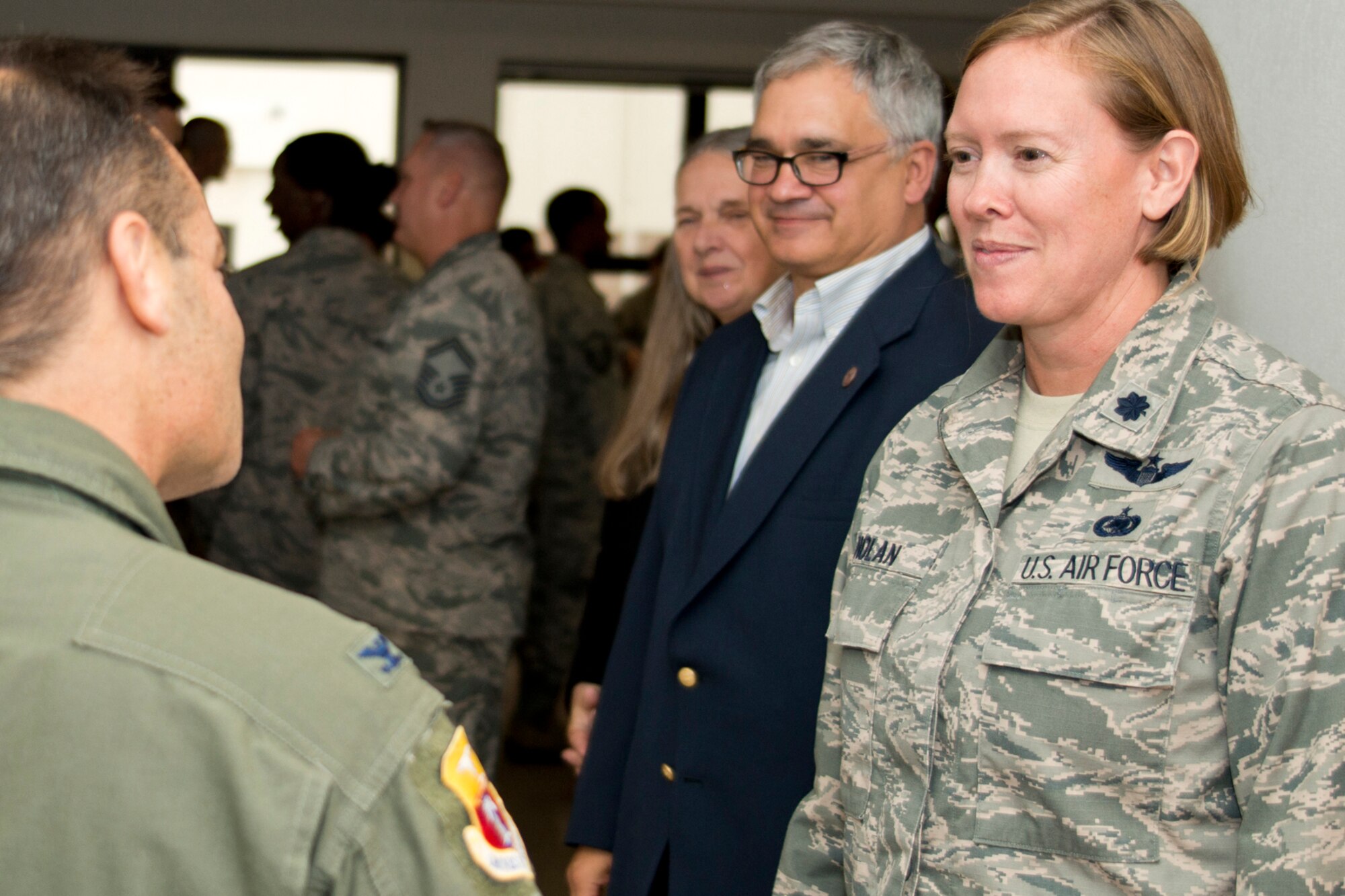 U.S. Air Force Reserve Col. Anthony Brusca, deputy commander for the 913th Airlift Group, congratulates Lt. Col. Tara E. Nolan, her husband and mother in the receiving line after the assumption of command ceremony for the 96th Aerial Port Squadron at Little Rock Air Force Base, Ark., Nov. 4, 2017.