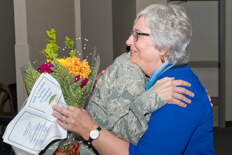 U.S. Air Force Reserve Lt. Col. Charlotte C. Appleton, commander, 913th Aerospace Medical Squadron, hugs her mother during the assumption of command ceremony for the 913 AMDS at Little Rock Air Force Base, Ark., Nov. 5, 2017.