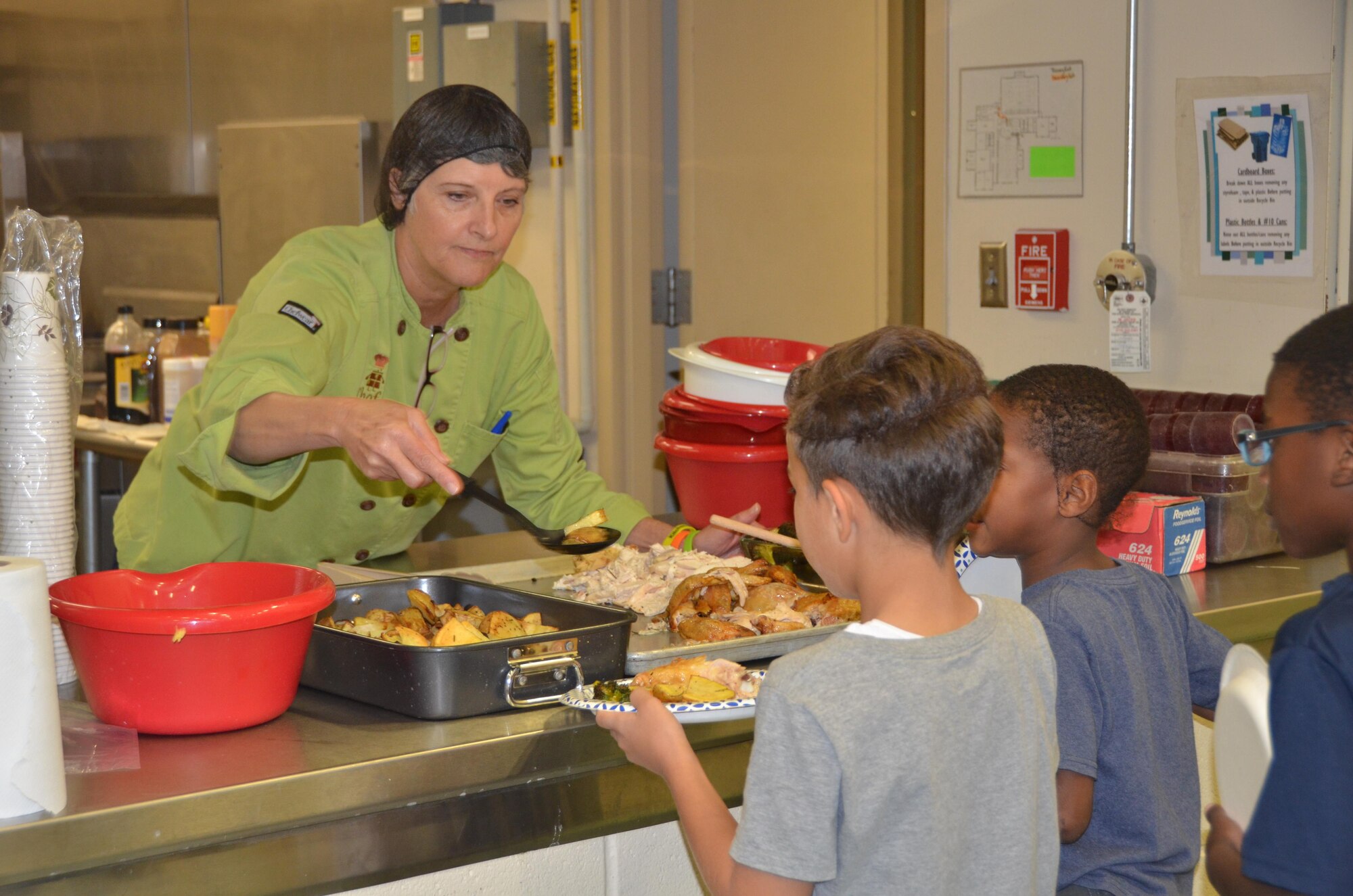 Laurie Zerga, founder of Chef-K, serves children a meal