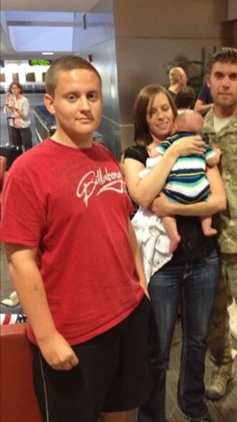 Airman 1st Class Austin Bristow, a heating, ventilation and air conditioning apprentice with the 319th Civil Engineer Squadron, left, poses with his family for a photo in July of 2016. Bristow changed his lifestyle two years ago in order to lose weight after realizing he was too heavy to join the Air Force. (Courtesy photo)