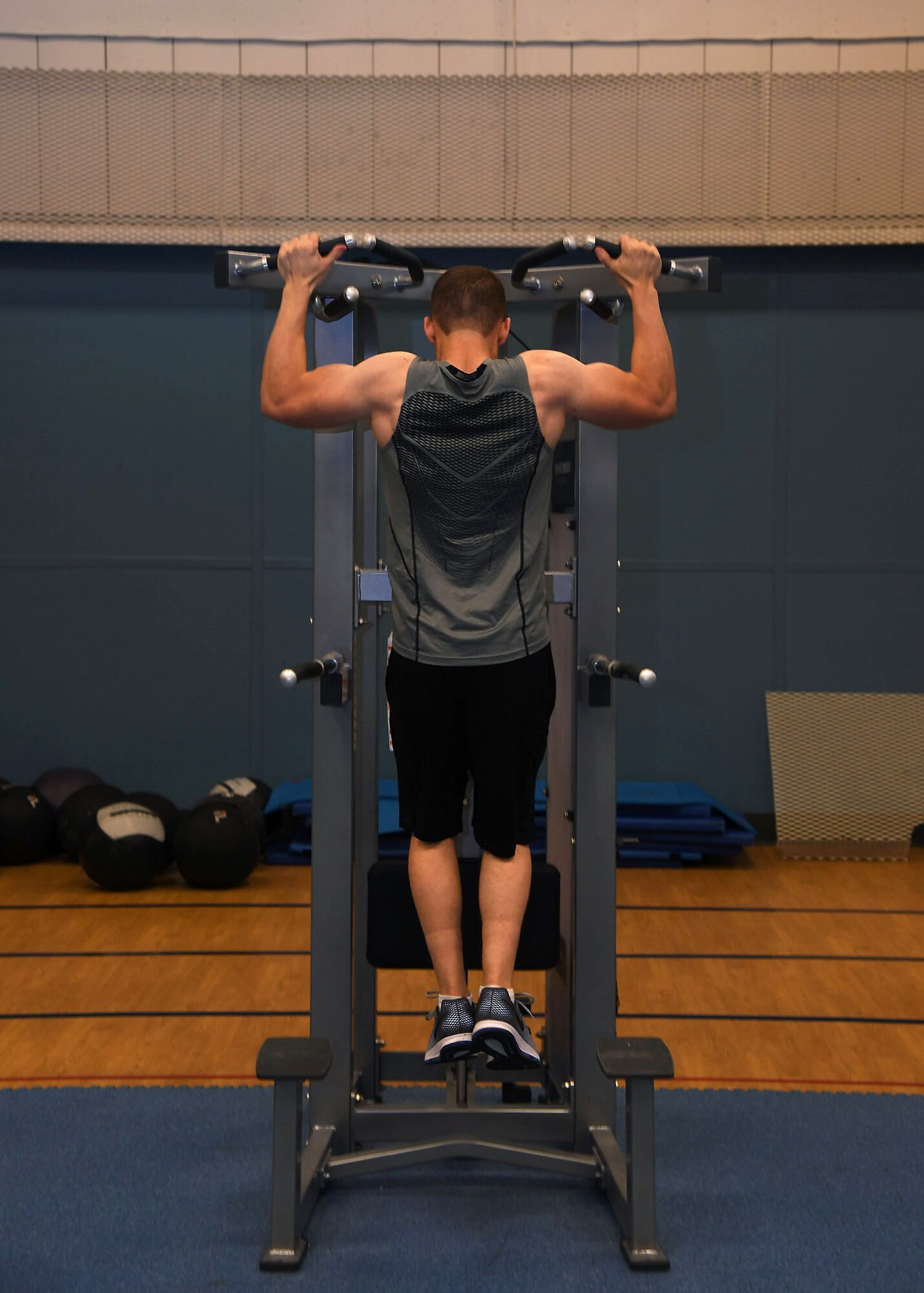 Airman 1st Class Austin Bristow, a heating, ventilation and air conditioning apprentice with the 319th Civil Engineer Squadron, performs a pull-up Nov. 2, 2017, in the fitness center on Grand Forks Air Force Base, N.D. Bristow started his fitness journey two years ago after he realized he was too heavy to enlist. (U.S. Air Force photo by Airman 1st Class Elora J. Martinez)