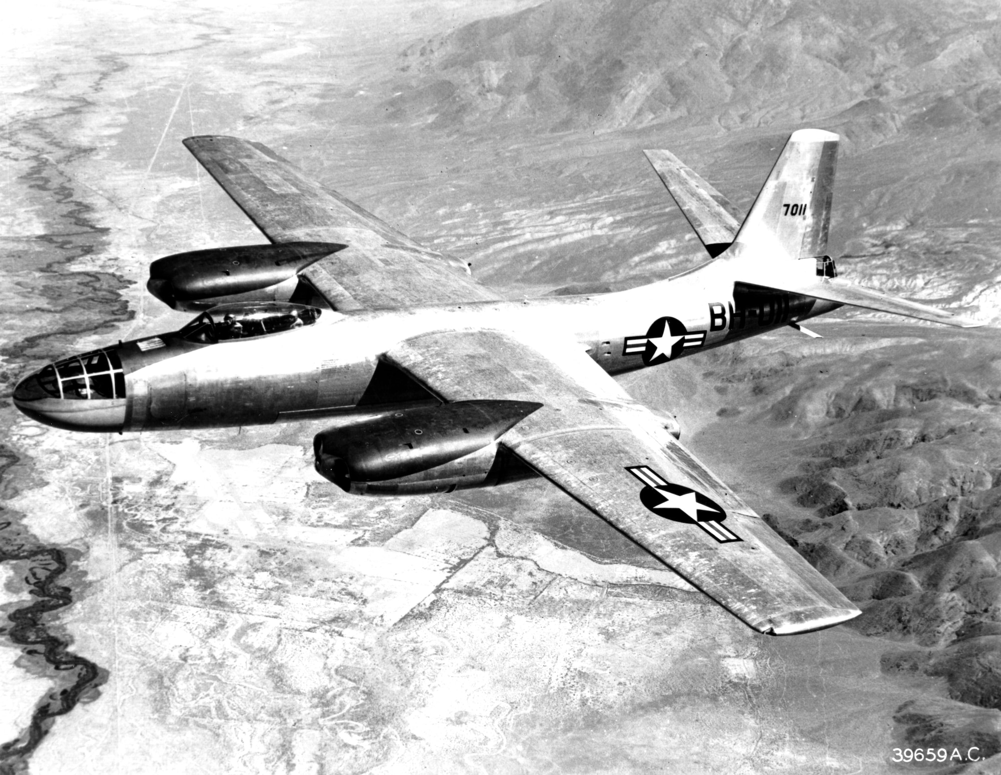 The North American B-45A Tornado shown during an early test flight from Muroc Dry Lake in California. B-45A model can be distinguished by the two-place cockpit under one single Plexiglas canopy.