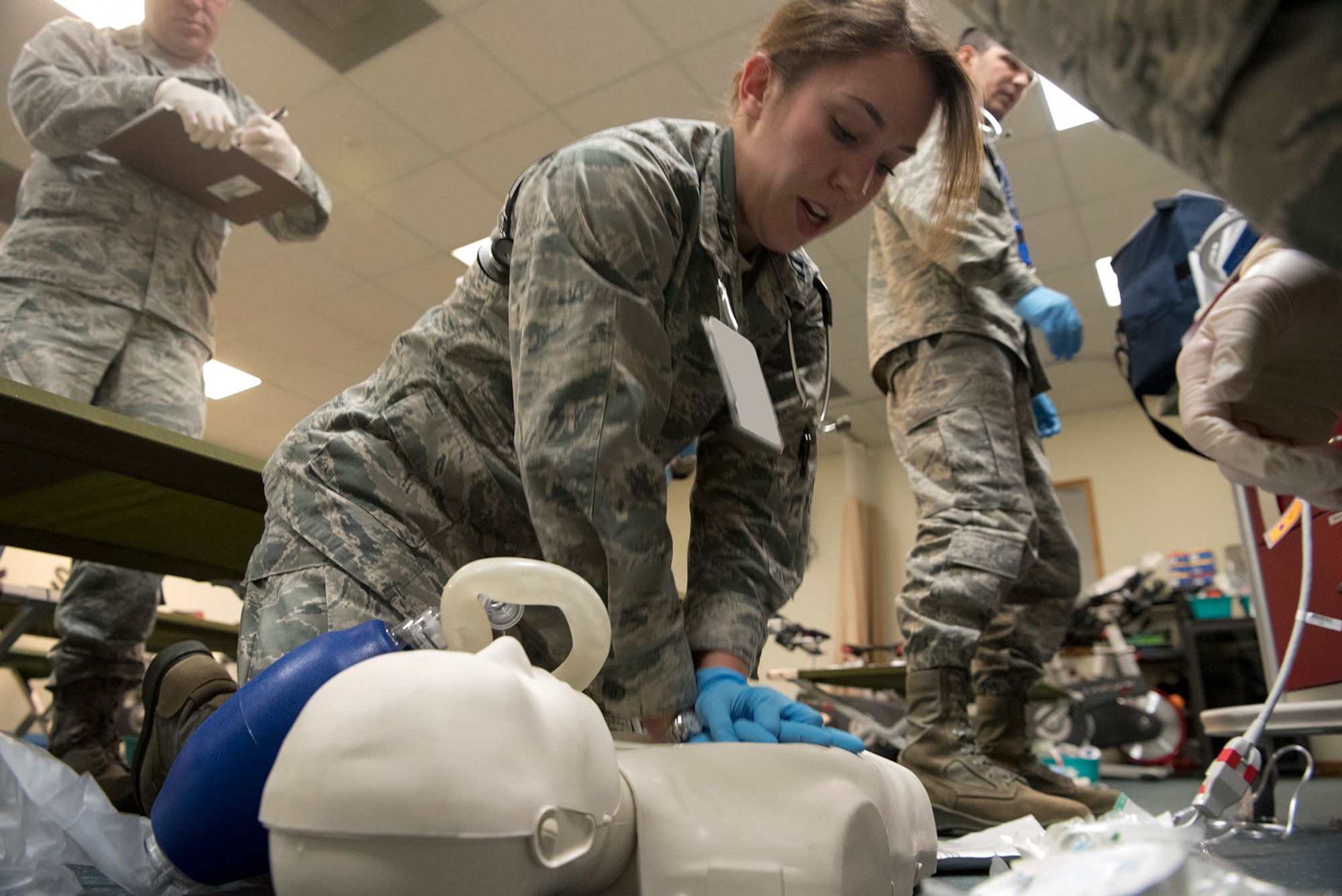 Capt. Emma Pinkerton, 21st Medical Group clinical nurse, performs CPR on a training dummy during a casualty training exercise at Cheyenne Mountain Air Force Station, Colorado, Nov. 3, 2017. The training incorporated a first response by the fire department with triage and treatment by the Medical Group. (U.S. Air Force photo by Steve Kotecki)