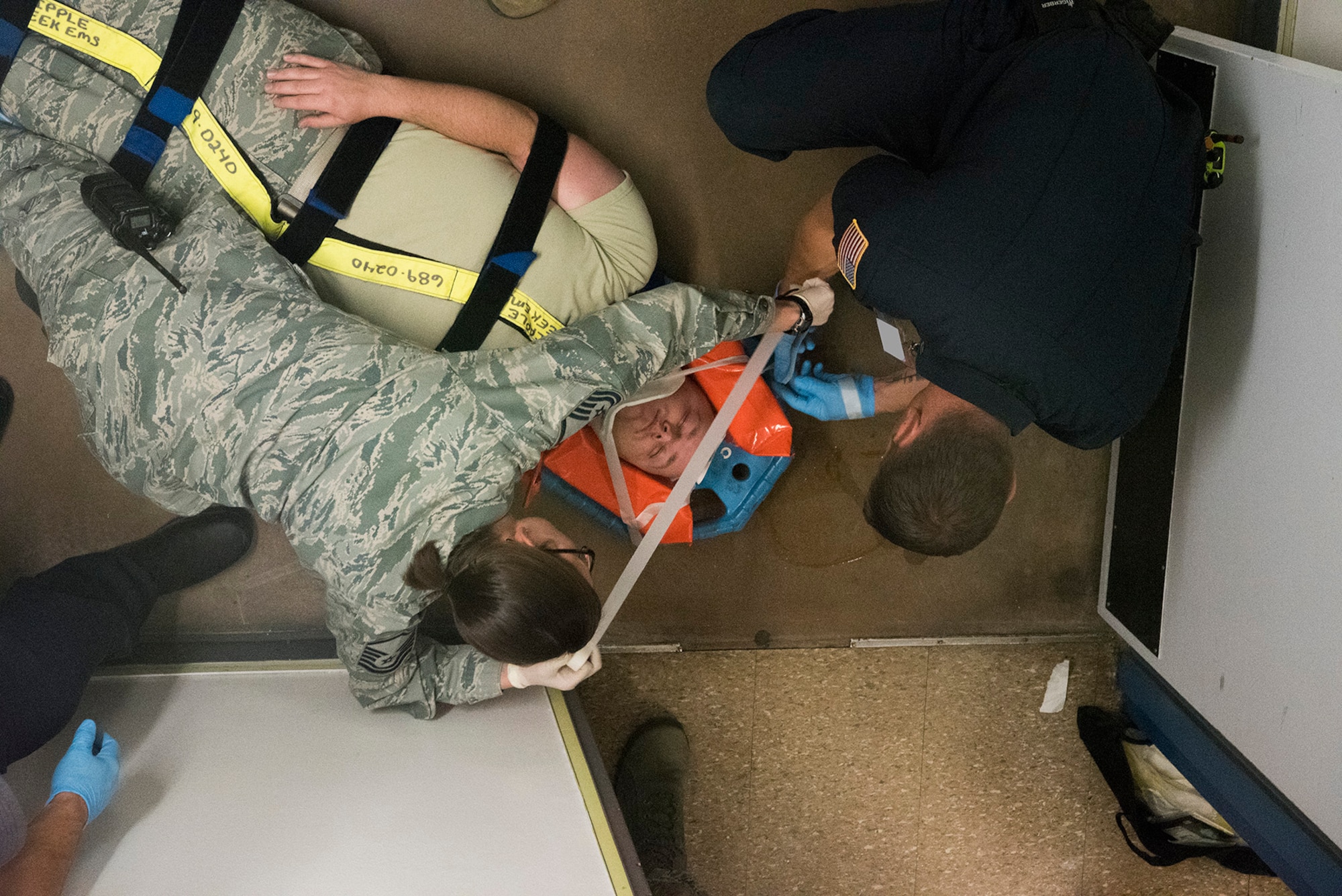 First Responders from the 721st Medical Squadron and Cheyenne Mountain Air Force Station Fire Department treat an acting patient who has suffered a fall during exercise Global Thunder/Vigilant Shield at Cheyenne Mountain AFS, Colorado, Nov. 2, 2017. The exercise is designed to test the readiness of Cheyenne Mountain AFS’s Airmen in the event of a crisis. (U.S. Air Force photo by Steve Kotecki)