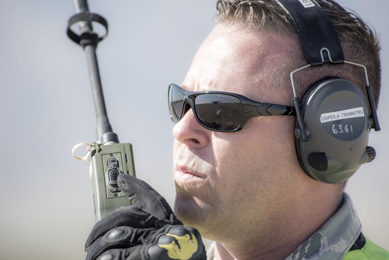 Tech. Sgt. Attila Csipes, 49th Logistics Readiness Squadron Small Air Terminal non commissioned officer in charge speaks with the pilots aboard a C-130 Hercules from Little Rock Air Force Base, Ark., for Vigilant Shield 18 at White Sands Missile Range, N.M., Oct. 31, 2017.  The exercise tests the short notice deployment capabilities of Airmen and Soldiers.  (U.S. Air Force photo by Tech. Sgt. Jeff Howerton)