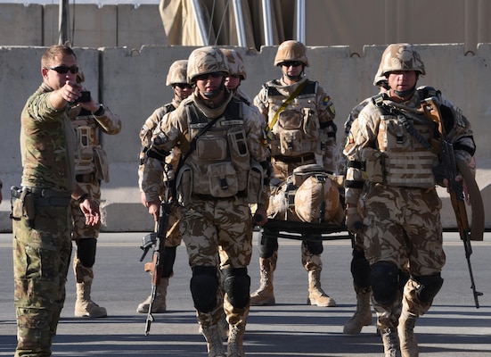Soldiers with the Romanian Armed Forces trained with Task Force Marauder on hot and cold-load procedures for a casualty on a UH-60 Black Hawk, Nov. 6, 2017, in order to know how to safely load a patient in the event of a real-world emergency in Afghanistan where TF Marauder MEDEVAC responds. TF Marauder is made up of Soldiers from South Carolina National Guard, Illinois National Guard, Iowa National Guard, as well as active duty component and provides aviation capabilities with AH64 Apaches, UH60 Black Hawks, CH47 Chinooks, and MEDEVAC assets in Afghanistan under the 3rd Combat Aviation Brigade while deployed. (U.S. Army National Guard photo by Capt. Jessica Donnelly, Task Force Marauder)