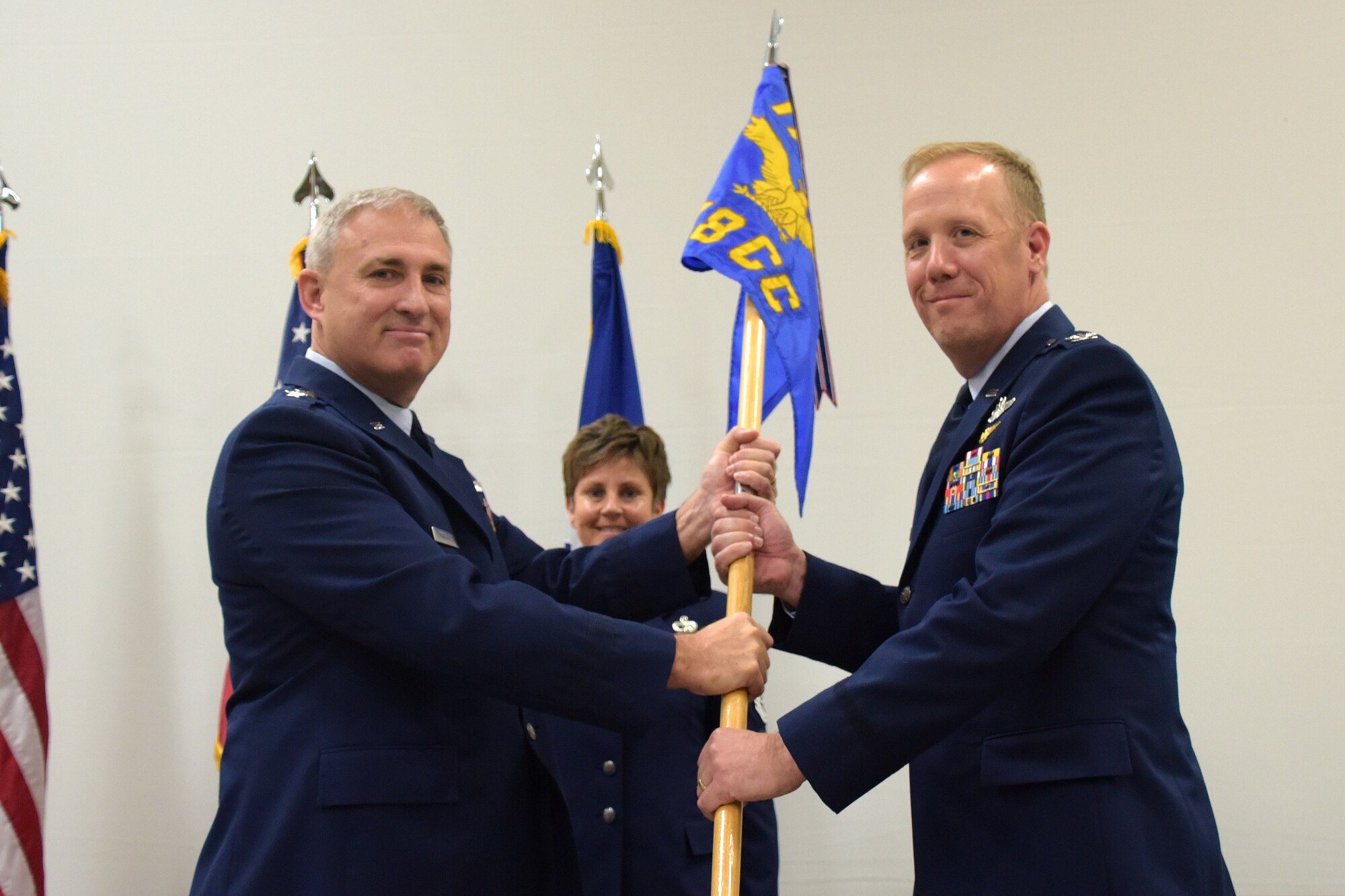 Col. Gregg Hesterman, the 178th Wing commander, assumes his new leadership position during a change of command ceremony at Springfield Air National Guard Base in Springfield, Ohio, Nov. 4, 2017. Maj. Gen. Stephen Markovich, the Ohio National Guard Commander for Air, passed the guidon to Hesterman. Col. John Knabel relinquished command and retired after 29 years of military service.