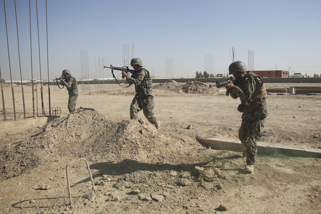 Afghan National Army soldiers with 6th Kandak, 1st Brigade, 215th Corps maneuver toward a notional enemy position during a platoon attack exercise at Camp Shorabak, Afghanistan, Nov. 6, 2017. The training was part of the operational readiness cycle, an eight-week course led by ANA instructors at the Helmand Regional Military Training Center. The curriculum focuses on developing the warfighting tactics and techniques of its students in order to support future combat operations against the Taliban throughout the province. (U.S. Marine Corps photo by Sgt. Lucas Hopkins)