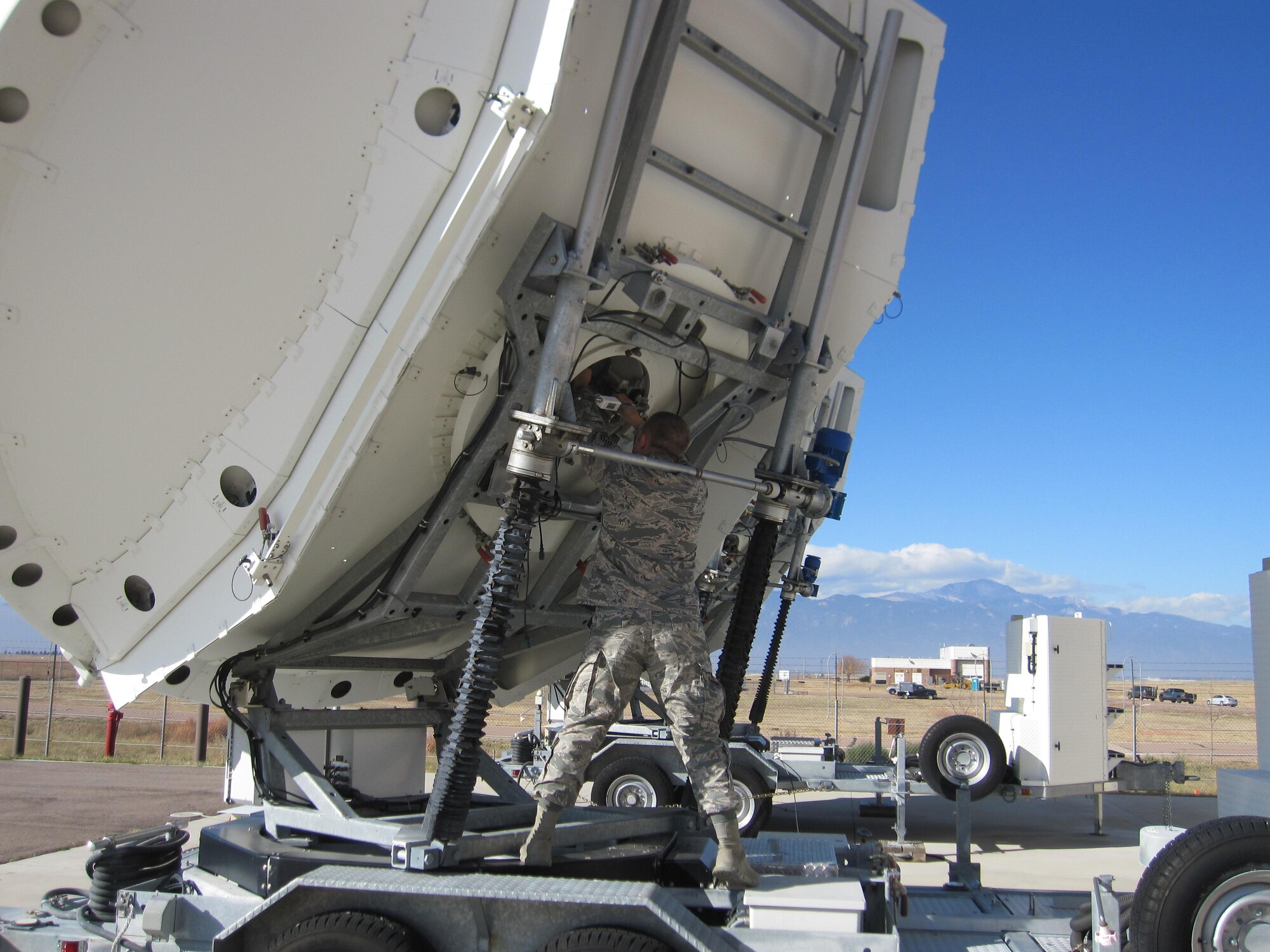 Tech Sgt. Robert Hicks, 16th SPCS flight chief and maintainer, makes adjustments on a piece of equipment Nov. 3, 2017, at Peterson Air Force Base, Colorado. The 16th SPCS uses such equipment to defend access to the space domain by identifying, characterizing, and geolocating specific signals broadcast from many sources. (Courtesy photo)