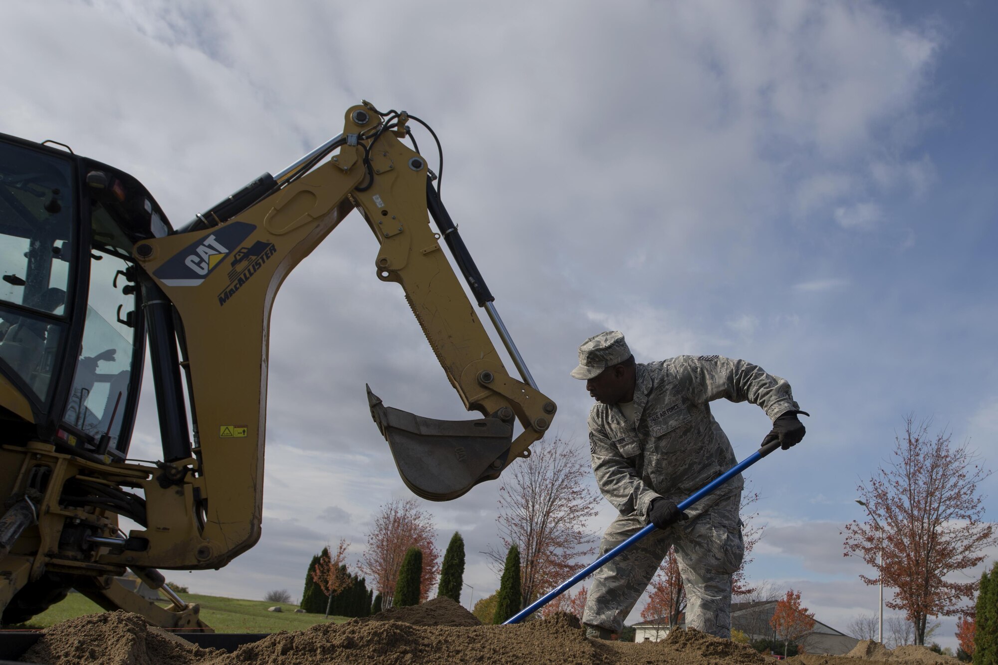 Tech Sgt. Anthony Jackson, 434th Civil Engineer Squadron heavy equipment operator, levels out the sand at the new sand pit at Grissom Air Reserve Base, Ind. on Nov. 6, 2017. The sand pit will be used to provide Airmen with hands on training in a sandy environment. (U.S. Air Force photo/Staff Sgt. Dakota Bergl)