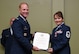 Col. James W. Kellogg, 94th Airlift Wing commander, presents Senior Master Sgt. Donna Bridges, 94th AW law office superintendent, with her certificate of retirement at Dobbins Air Reserve Base, Ga. Nov. 4, 2017. Bridges served 34 years in the U.S. Air Force. (U.S. Air Force photo/Senior Airman Justin Clayvon)