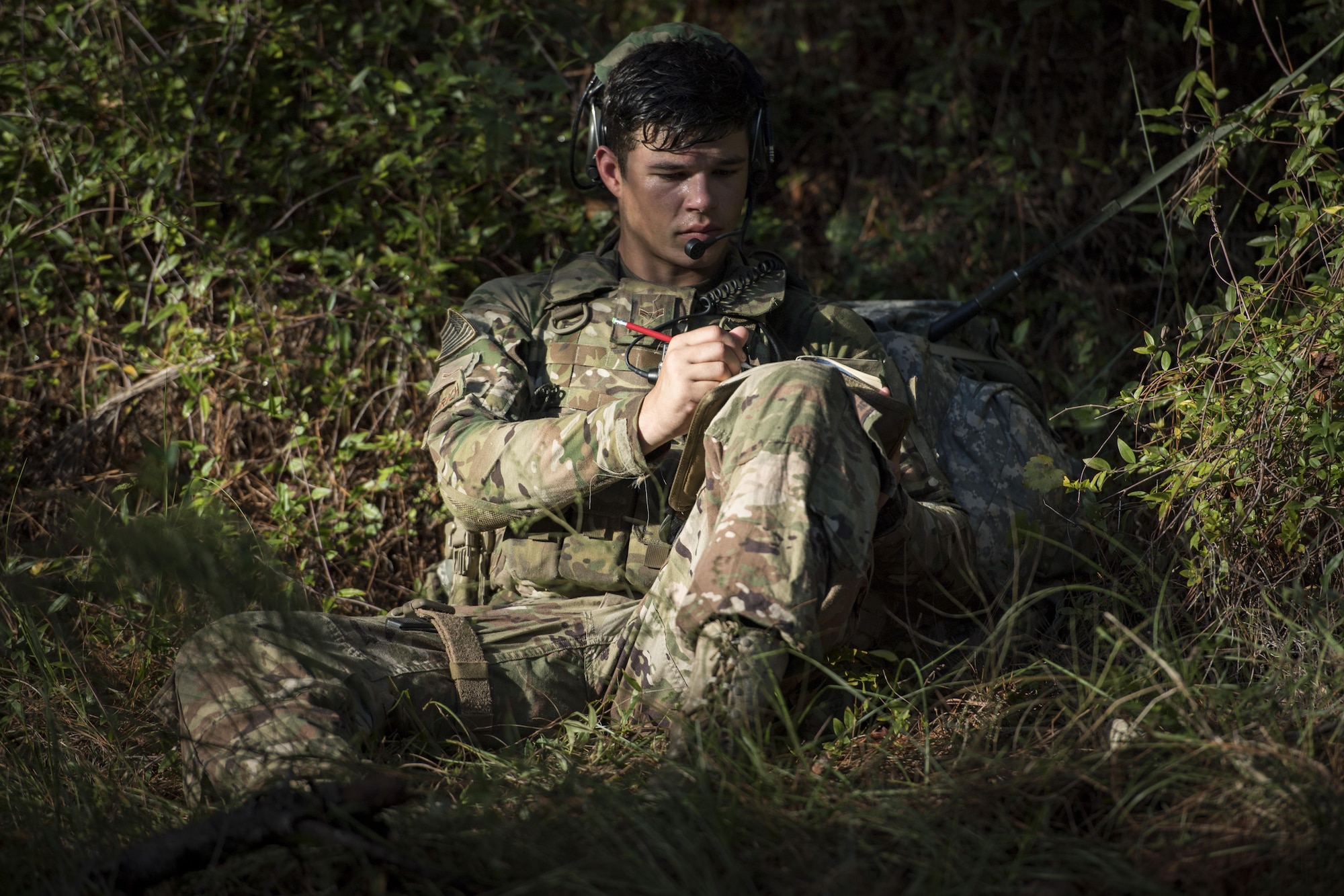 Airman 1st Class Mason Wiedrich, 823d Base Defense Squadron fireteam member, writes down field notes after a simulated ambush during a mission readiness exercise, Oct. 23, 2017, at Moody Air Force Base, Ga. The 820th Base Defense Group tested the 823d BDS’s ability to operate in an austere environment with challenging scenarios that tested their capabilities and effectiveness. (U.S. Air Force Senior Airman Janiqua P. Robinson)