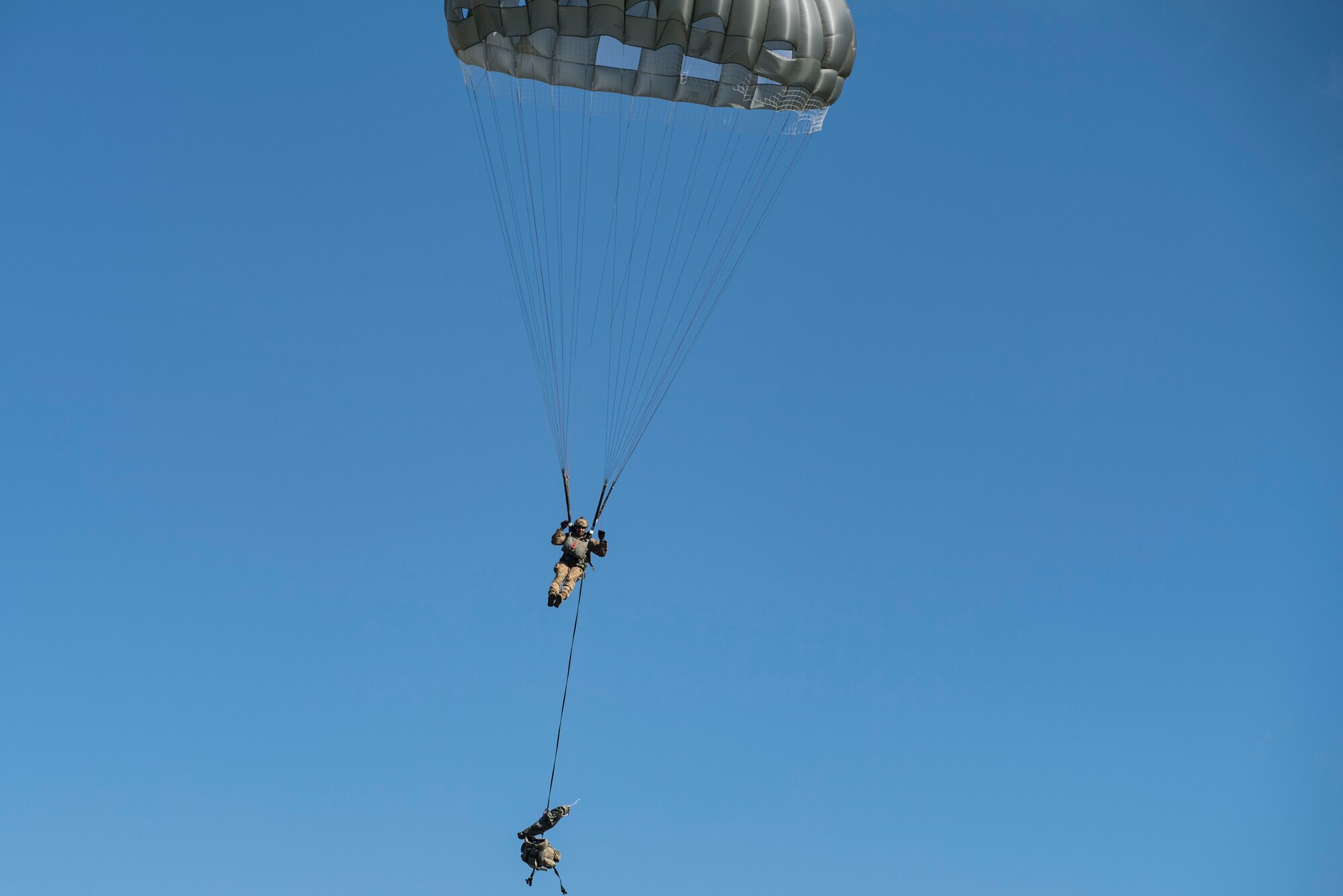 Master Sgt. Franz Bruce-Salmon, 823d Base Defense Squadron NCOIC of force protection intelligence, descends after jumping out of an HC-130J Combat King II, during a mission readiness exercise, Oct. 20, 2017, at Moody Air Force Base, Ga. The 820th Base Defense Group tested the 823d BDS’s ability to operate in an austere environment with challenging scenarios that tested their capabilities and effectiveness. (U.S. Air Force Senior Airman Janiqua P. Robinson)