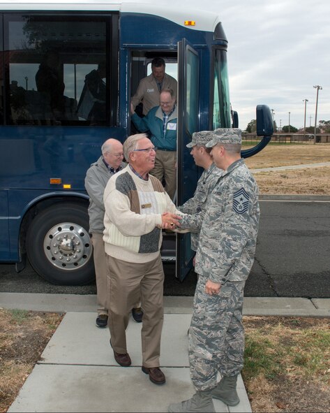 U.S. Air Force Col. John Klein, 60th Air Mobility Wing commander, and Chief Master Sgt. Steve Nichols, 60 AMW command chief, greet honorary commanders during their tour of the 60th Mission Support Group, Nov. 3, 2017, at Travis Air Force Base, Calif. The purpose of the Travis Air Force Base Honorary Commander Program is to promote relationships between base senior leadership and civilian partners, foster civic appreciation of the Air Force mission and its Airmen, maximize opportunities to share the Air Force story with new stewards, and to communicate mutual interest, challenges, and concerns that senior leaders and civilian stakeholders have in common. (U.S. Air Force photo by Louis Briscese)