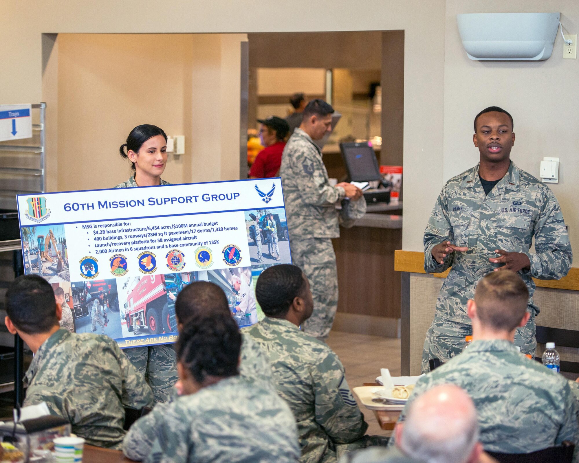 Airmen brief honorary commanders during A tour of the 60th Mission Support Group, Nov. 3, 2017, at Travis Air Force Base, Calif. The purpose of the Travis Air Force Base Honorary Commander Program is to promote relationships between base senior leadership and civilian partners, foster civic appreciation of the Air Force mission and its Airmen, maximize opportunities to share the Air Force story with new stewards, and to communicate mutual interest, challenges, and concerns that senior leaders and civilian stakeholders have in common. (U.S. Air Force photo by Louis Briscese)