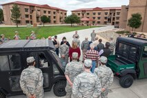 Honorary commanders visit the dormitories during a tour of the 60th Mission Support Group, Nov. 3, 2017, at Travis Air Force Base, Calif.  The purpose of the Travis Air Force Base Honorary Commander Program is to promote relationships between base senior leadership and civilian partners, foster civic appreciation of the Air Force mission and its Airmen, maximize opportunities to share the Air Force story with new stewards, and to communicate mutual interest, challenges, and concerns that senior leaders and civilian stakeholders have in common. (U.S. Air Force photo by Louis Briscese)