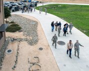 Honorary commanders visit the dormitories during a tour of the 60th Mission Support Group, Nov. 3, 2017, at Travis Air Force Base, Calif.  The purpose of the Travis Air Force Base Honorary Commander Program is to promote relationships between base senior leadership and civilian partners, foster civic appreciation of the Air Force mission and its Airmen, maximize opportunities to share the Air Force story with new stewards, and to communicate mutual interest, challenges, and concerns that senior leaders and civilian stakeholders have in common. (U.S. Air Force photo by Louis Briscese)