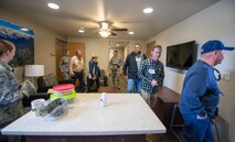 Honorary commanders visit the dormitories during a tour of the 60th Mission Support Group, Nov. 3, 2017, at Travis Air Force Base, Calif.  The purpose of the Travis Air Force Base Honorary Commander Program is to promote relationships between base senior leadership and civilian partners, foster civic appreciation of the Air Force mission and its Airmen, maximize opportunities to share the Air Force story with new stewards, and to communicate mutual interest, challenges, and concerns that senior leaders and civilian stakeholders have in common. (U.S. Air Force photo by Louis Briscese)