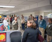 Honorary commanders visit the 60th Communication Squadron during a tour of the 60th Mission Support Group, Nov. 3, 2017, at Travis Air Force Base, Calif.  The purpose of the Travis Air Force Base Honorary Commander Program is to promote relationships between base senior leadership and civilian partners, foster civic appreciation of the Air Force mission and its Airmen, maximize opportunities to share the Air Force story with new stewards, and to communicate mutual interest, challenges, and concerns that senior leaders and civilian stakeholders have in common. (U.S. Air Force photo by Louis Briscese)