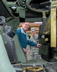 A honorary commander gets a ride in a Humvee during their tour of the 60th Mission Support Group, Nov. 3, 2017, at Travis Air Force Base, Calif.  The purpose of the Travis Air Force Base Honorary Commander Program is to promote relationships between base senior leadership and civilian partners, foster civic appreciation of the Air Force mission and its Airmen, maximize opportunities to share the Air Force story with new stewards, and to communicate mutual interest, challenges, and concerns that senior leaders and civilian stakeholders have in common. (U.S. Air Force photo by Louis Briscese)