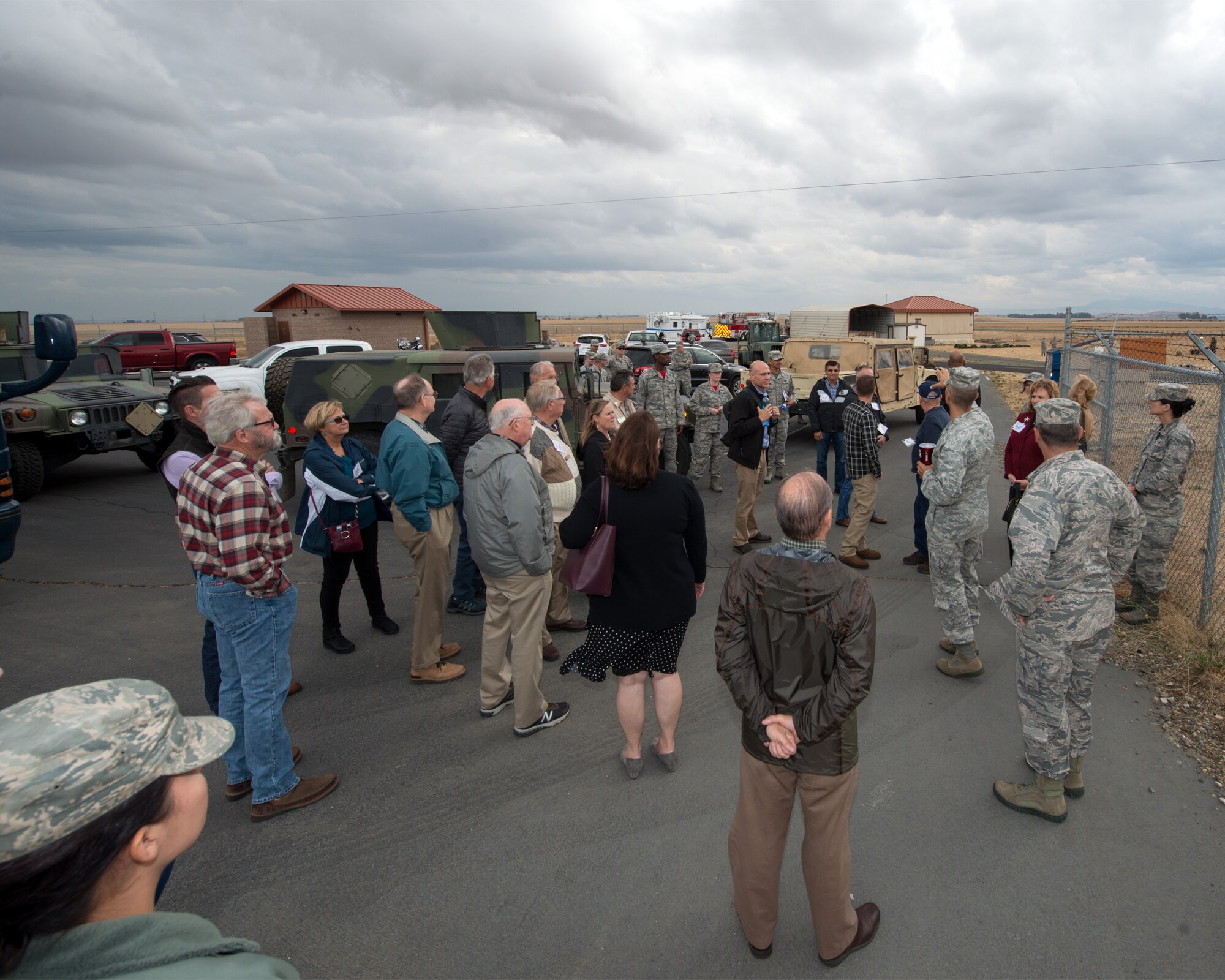 Honorary Commanders from Travis Air Force Base, Calif., prepare for their tour of the 60th Mission Support Group, Nov. 3, 2017 at Travis Air Force Bace, Calif.  The purpose of the Travis Air Force Base Honorary Commander Program is to promote relationships between base senior leadership and civilian partners, foster civic appreciation of the Air Force mission and its Airmen, maximize opportunities to share the Air Force story with new stewards, and to communicate mutual interest, challenges, and concerns that senior leaders and civilian stakeholders have in common. (U.S. Air Force photo by Louis Briscese)