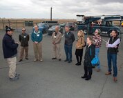 Honorary Commanders from Travis Air Force Base, Calif., prepare for their tour of the 60th Mission Support Group, Nov. 3, 2017 at Travis Air Force Bace, Calif. The purpose of the Travis Air Force Base Honorary Commander Program is to promote relationships between base senior leadership and civilian partners, foster civic appreciation of the Air Force mission and its Airmen, maximize opportunities to share the Air Force story with new stewards, and to communicate mutual interest, challenges, and concerns that senior leaders and civilian stakeholders have in common. (U.S. Air Force photo by Louis Briscese)