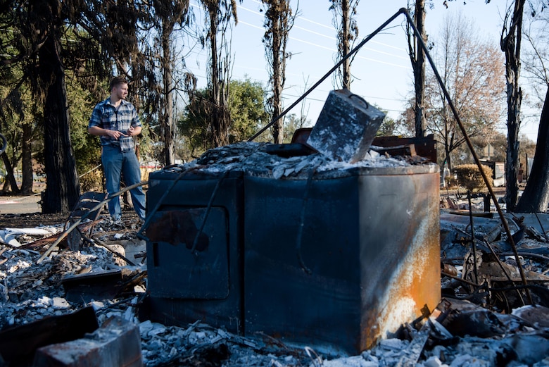 Senior Airman Martin Baglien, 349th Civil Engineer Squadron firefighter, surveys the remains of his family’s home after the California wildfire in Santa Rosa, Calif., on Oct. 31, 2017. The recent wildfires consumed more than 15,000 homes, and caused at least $3 billion in damage. The city of Santa Rosa alone lost 5 percent of it’s housing.