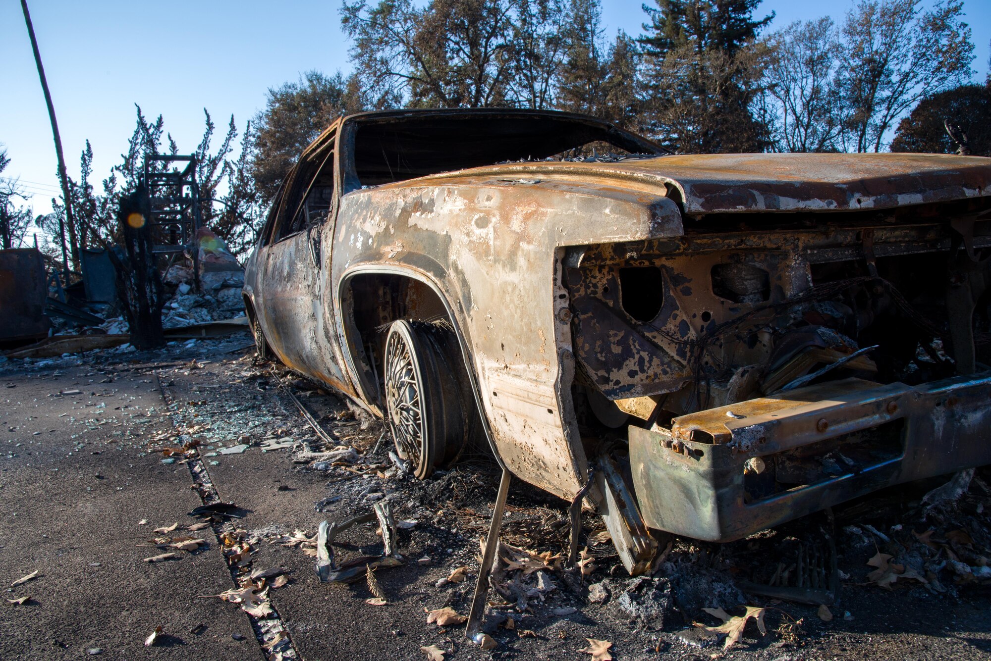 A burned out car lies in front of the remains of a house that was destroyed by the California wildfire in Santa Rosa, Calif., on Oct. 31, 2017. The recent wildfires destroyed more than 15,000 homes and caused more than $3 billion in damages.