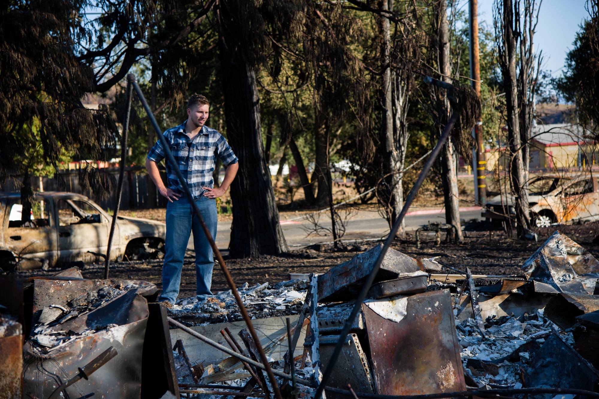Senior Airman Martin Baglien, 349th Civil Engineer Squadron firefighter, surveys the remains of his family’s home after the California wildfire in Santa Rosa, Calif., on Oct. 31, 2017. The recent wildfires consumed more than 15,000 homes, and caused at least $3 billion in damage.