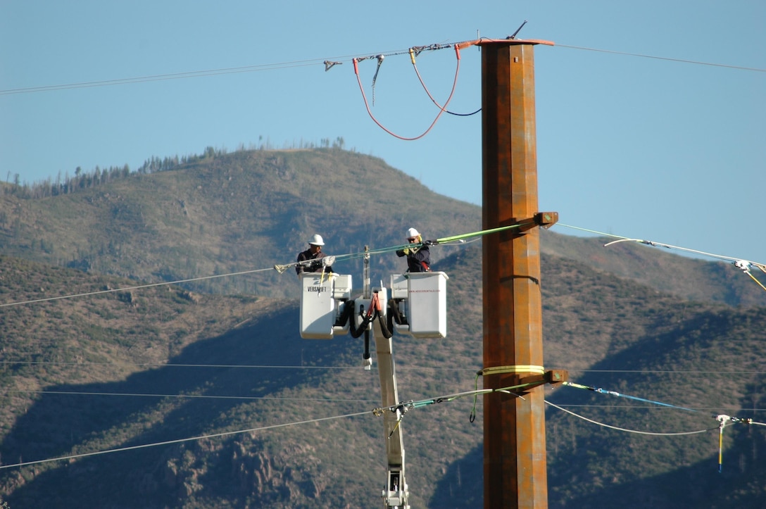 LOS ALAMOS, N.M. – Workers work on the TA3 substation at Los Alamos National Labs, Sept. 20, 2017.