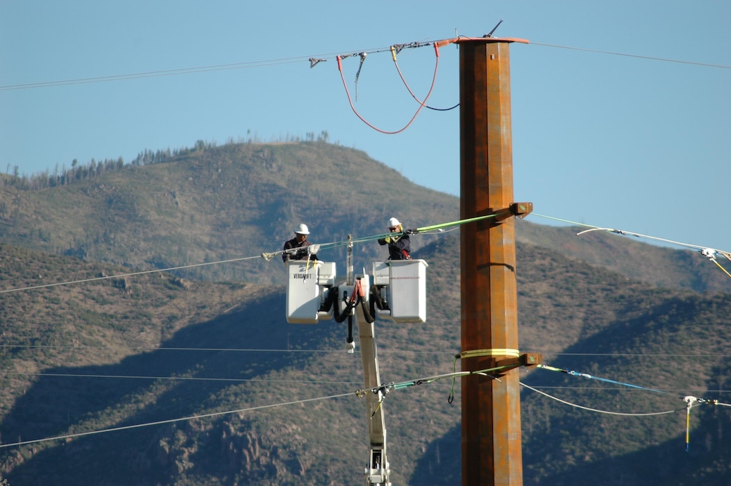 LOS ALAMOS, N.M. – Workers work on the TA3 substation at Los Alamos National Labs, Sept. 20, 2017. Photo by Al Lopez. This 2017 Photo Drive entry was the Commander's Choice Award winner.
