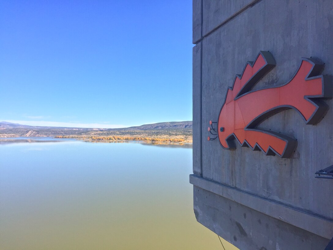 COCHITI LAKE, N.M. – A close up view of the Cochiti symbol on the control tower at the dam with the lake in the background, Oct. 26, 2017.