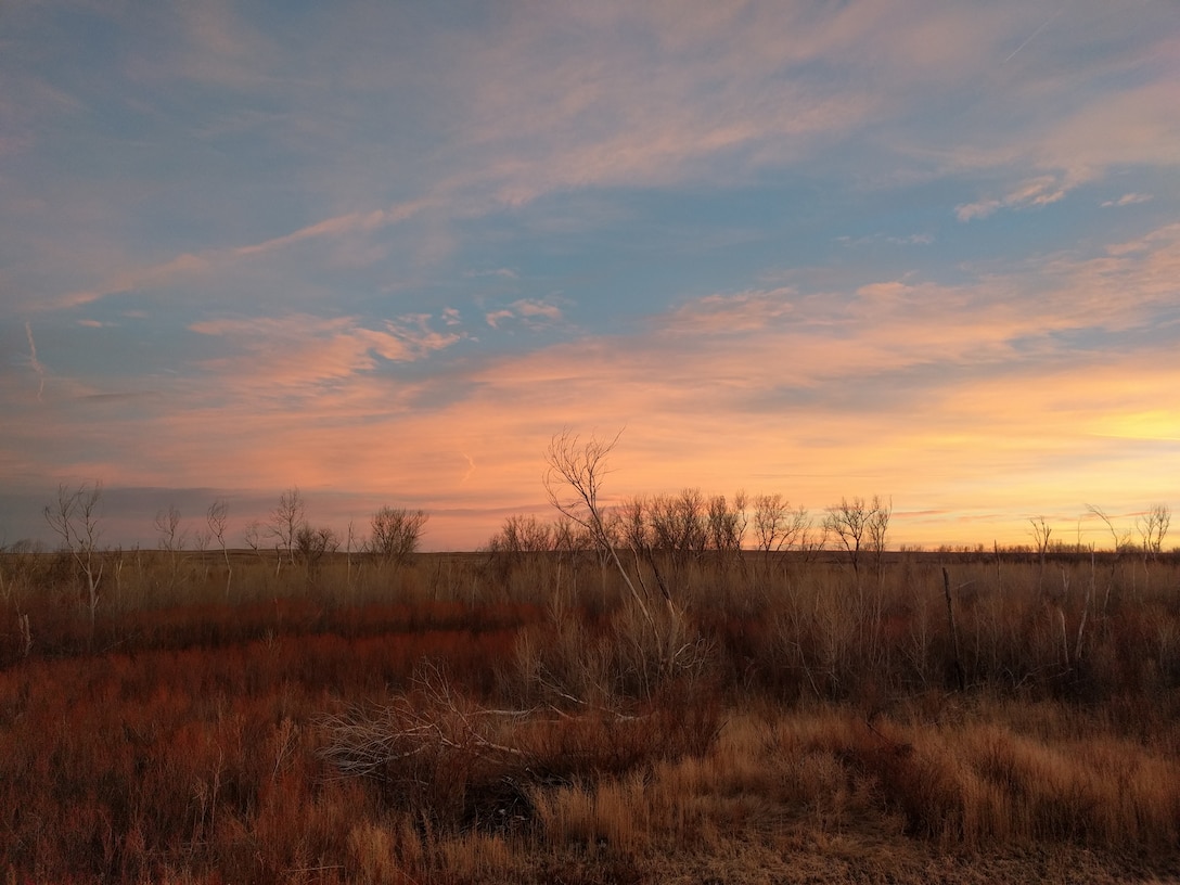 FORT LYON, Colo., -- The sunset as seen from the top of the Forty Lyon Levee near the Arkansas River, Jan. 31, 2017.