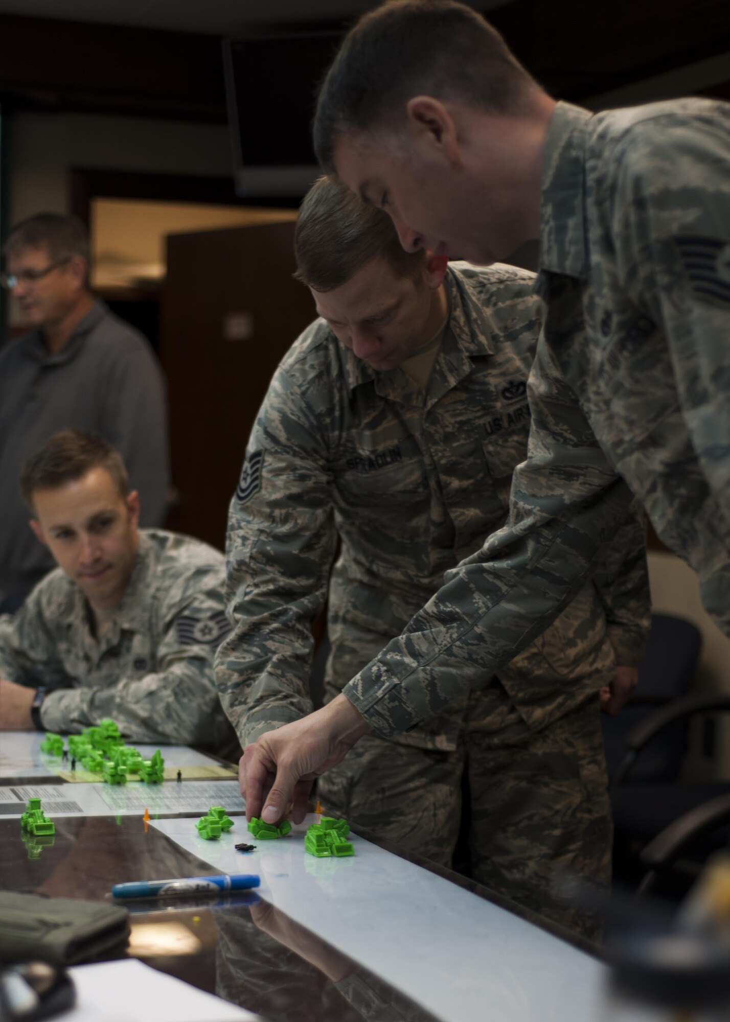 U.S. Air Force Airmen assigned to the 8th Civil Engineer Squadron participate in the strategic planning portion of rapid airfield damage repair training at Kunsan Air Base, Republic of Korea, Oct. 25, 2017. The new RADR process was developed by the Air Force Civil Engineer Center to repair damaged airfields at a faster pace. (U.S. Air Force photo by Staff Sgt. Victoria H. Taylor)