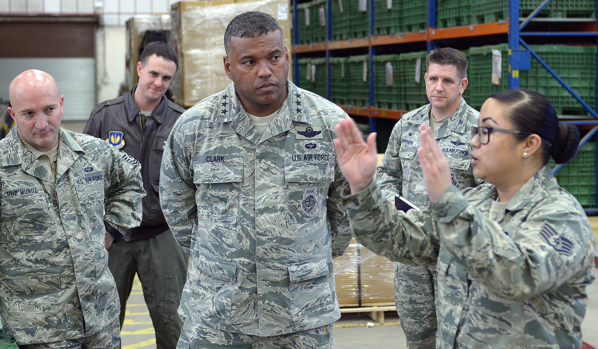 U.S. Air Force Lt. Gen. Richard M. Clark, 3rd Air Force commander, toured the 100th Logistics Readiness Squadron Nov. 6, 2017, on RAF Mildenhall, England. Clark listened as Staff Sgt. Tiani Talledo, 100th LRS individual protective equipment Supervisor, described the innovations they have made for deployment readiness. (U.S. Air Force photo by Airman 1st Class Benjamin Cooper)