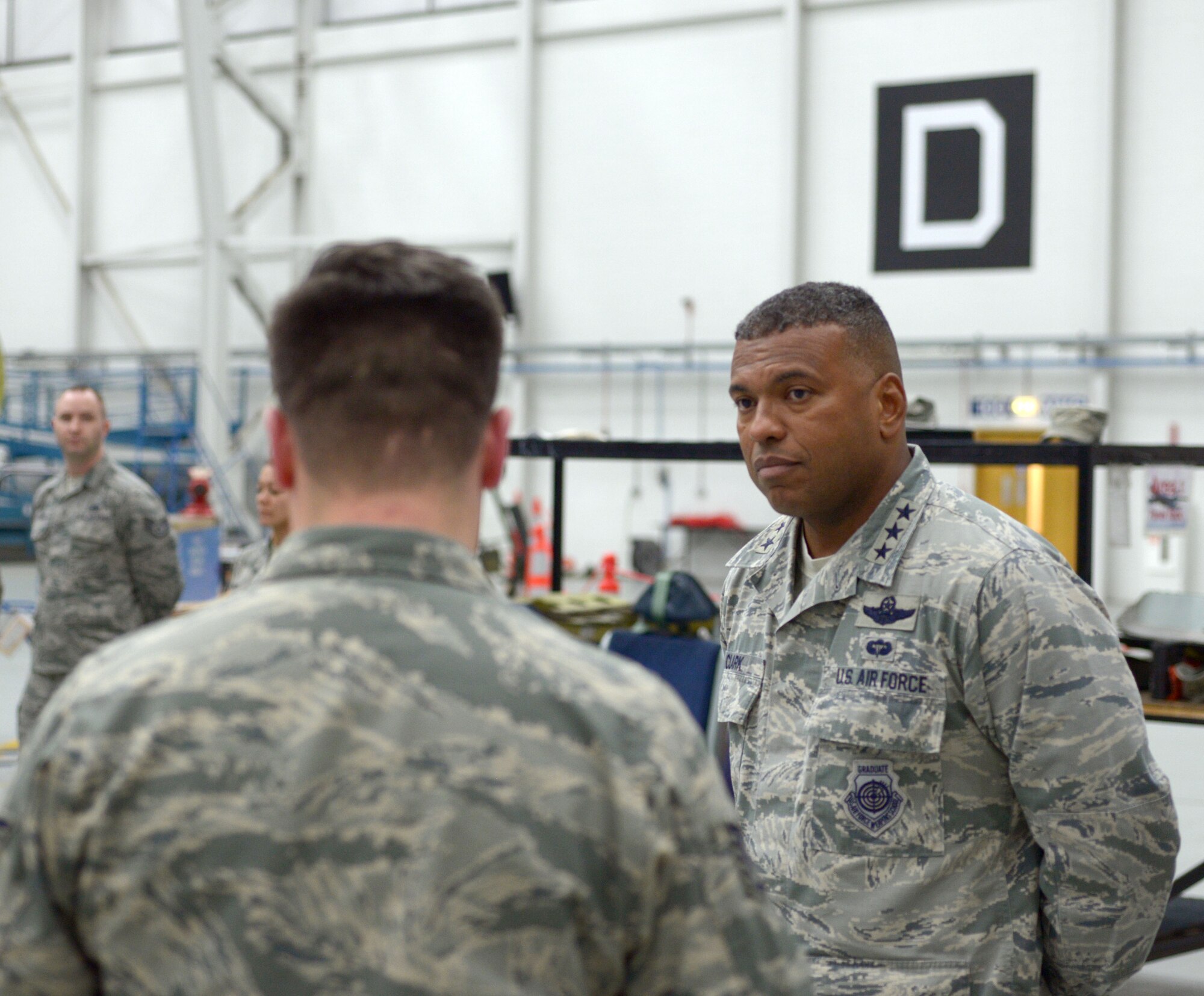U.S. Air Force Lt. Gen. Richard M. Clark, 3rd Air Force commander, tours the 100th Maintenance Squadron Nov. 6, 2017, on RAF Mildenhall, England. Clark met with Airmen from the 100th MXS and learned about how their duties affect the mission of the 100th Air Refueling Wing. (U.S. Air Force photo by Airman 1st Class Benjamin Cooper)