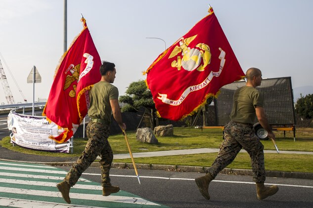 MAG-12 runs their battle colors in support of 1st MAW's 242-mile run