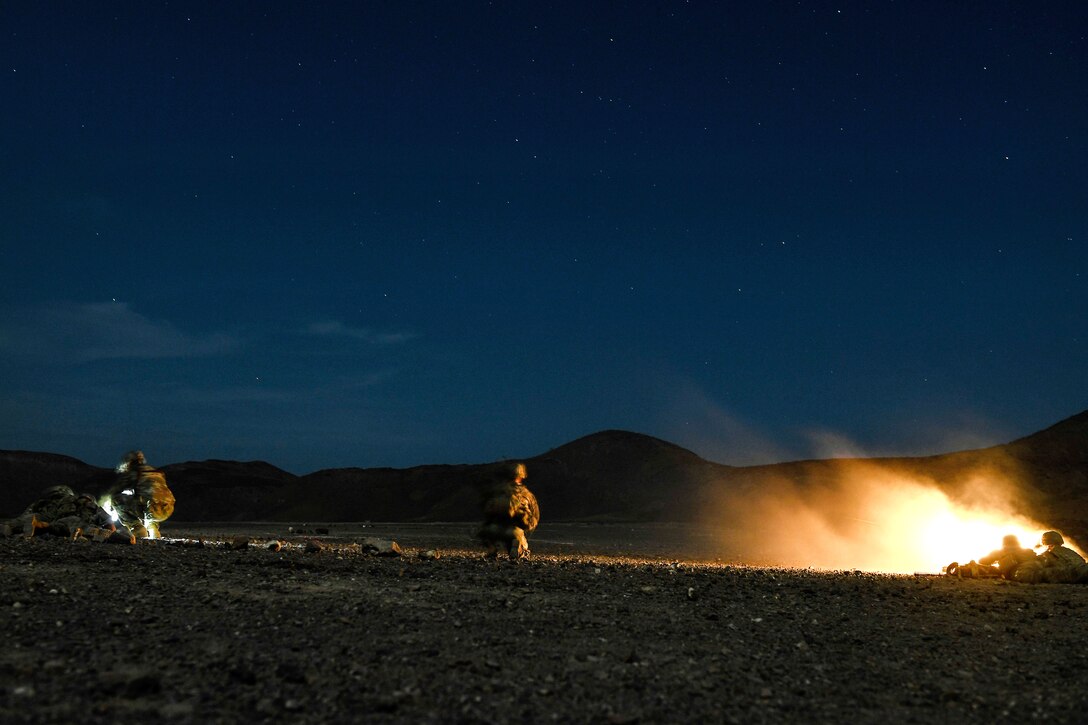 Soldiers fire M240 machine guns at targets in Djibouti.