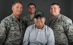 Col. Randy Huffman, vice wing commander of the 130th Airlift Wing, poses with his father, Senior Master Sgt. Danny Huffman, and sons Senior Airman Adam Huffman and Staff Sgt. Kyle Huffman.