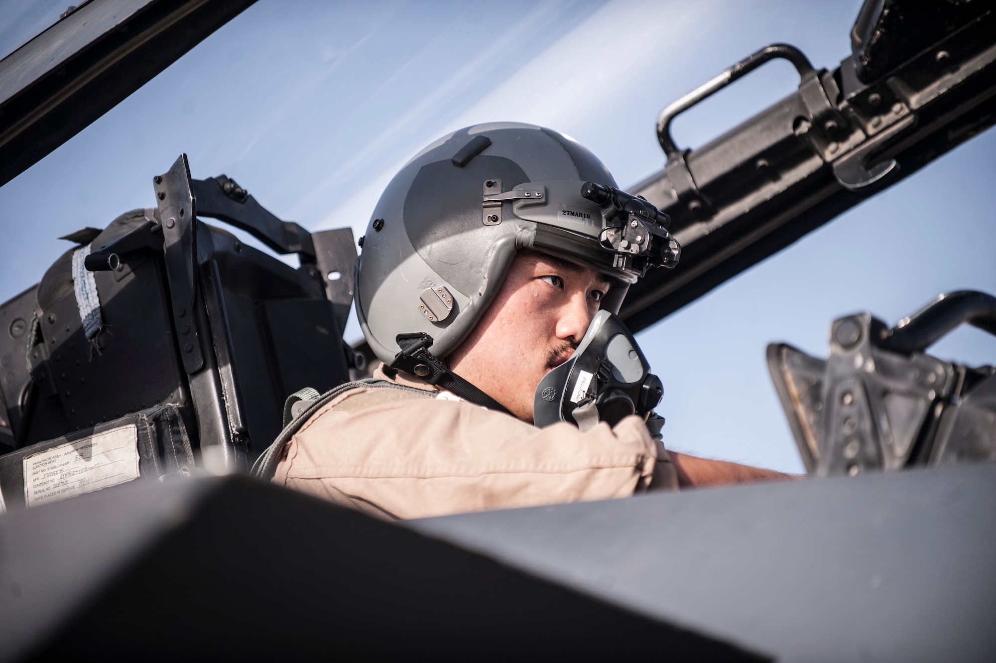 An aircrew member assigned to the 336th Expeditionary Fighter Squadron prepares his equipment for a sortie in support of Operation Inherent Resolve objectives November 3, 2017 in Southwest Asia. The 336th EFS flies the F-15E Strike Eagle, a dual-role fighter designed to excel in both air-to-air and air-to-ground missions. (U.S. Air Force photo by Senior Airman Joshua Kleinholz)