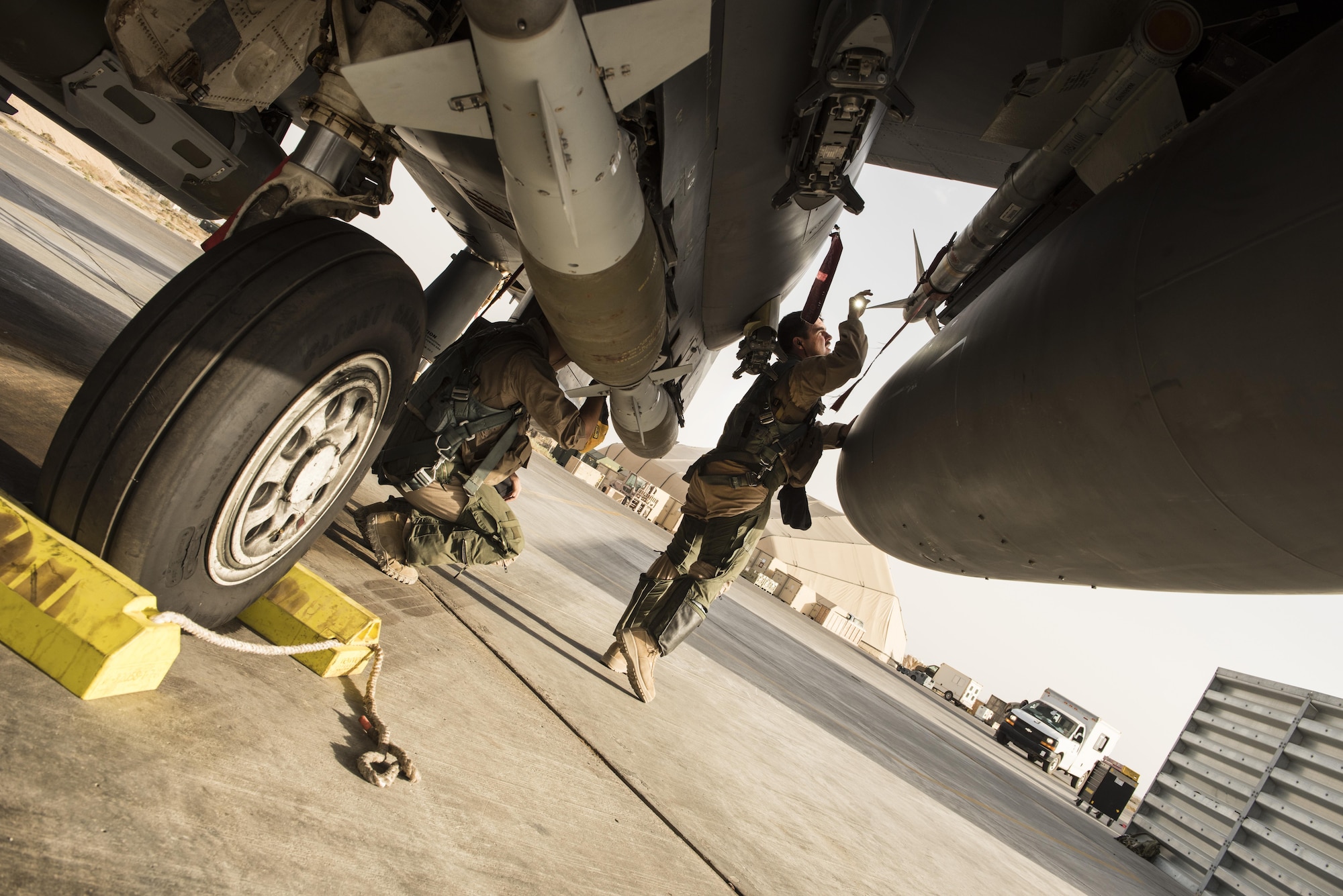 Aircrew members assigned to the 336th Expeditionary Fighter Squadron perform pre-flight checks prior to flying a sortie in support of Operation Inherent Resolve objectives November 3, 2017 in Southwest Asia. The 336th EFS is deployed from Seymour Johnson  Air Force Base, N. C. (U.S. Air Force photo by Senior Airman Joshua Kleinholz)